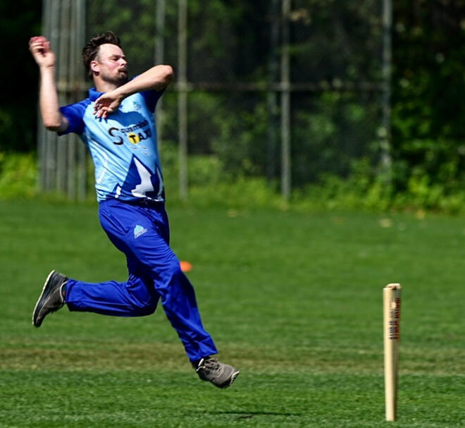A bowler approaches the stumps A bowler approaches the stumps